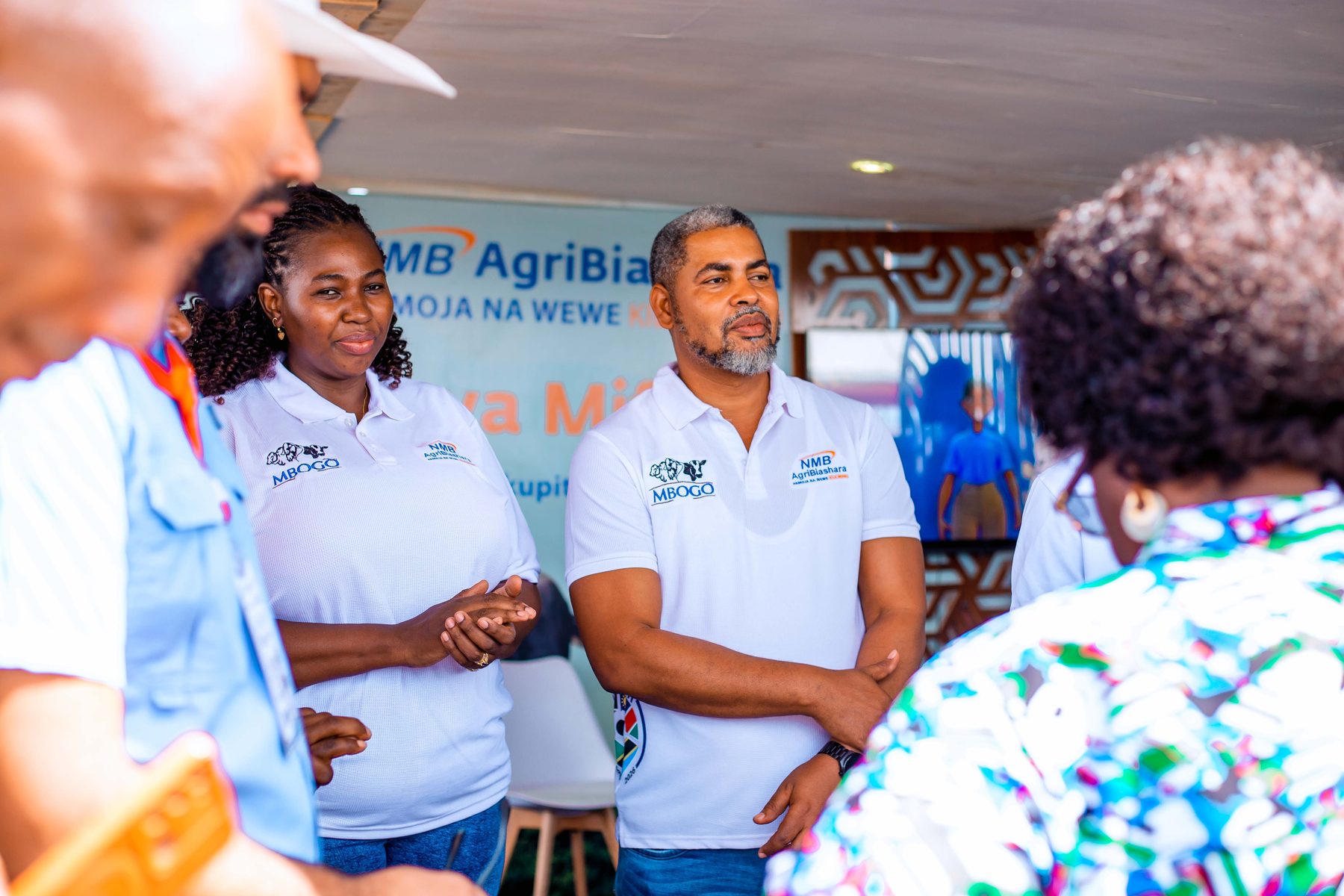 NMB staff engaging with attendees at the Ubena Zomozi agribusiness exhibition
