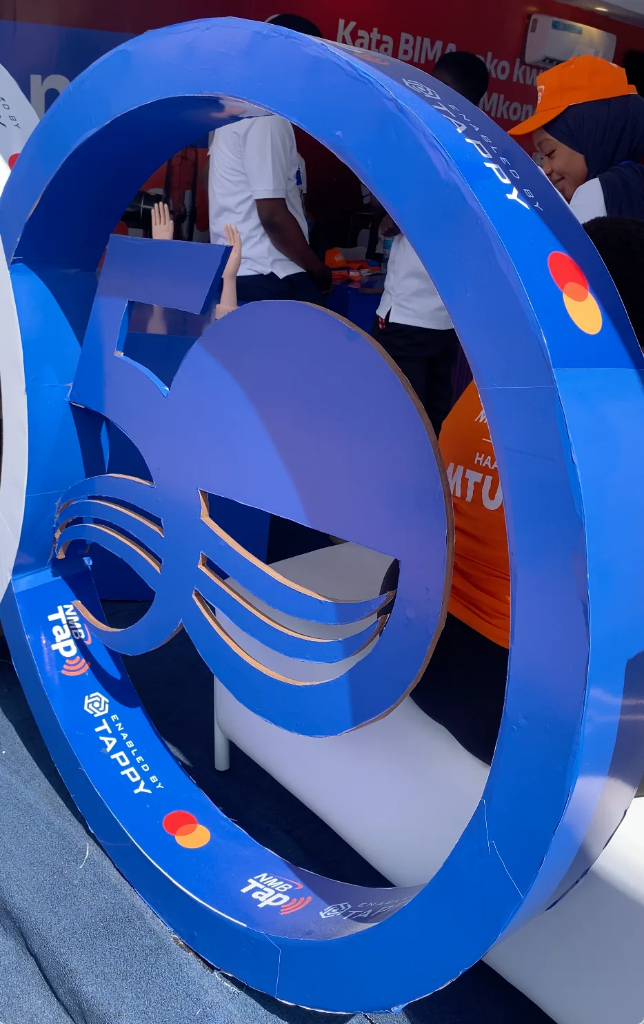 Custom-fabricated NMB Tap milestone set piece inside the pavilion, Saba Saba trade fair