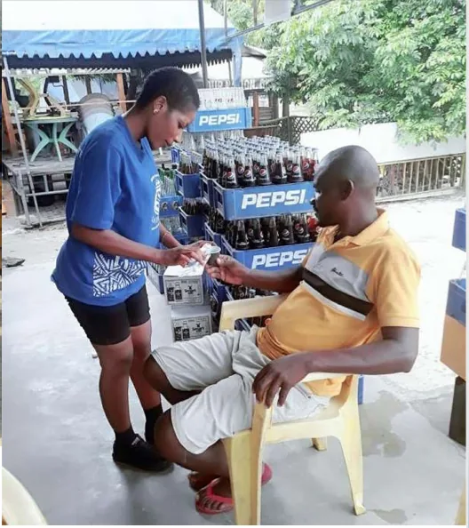 Safaya brand ambassador engaging a customer at a retail outlet during the activation