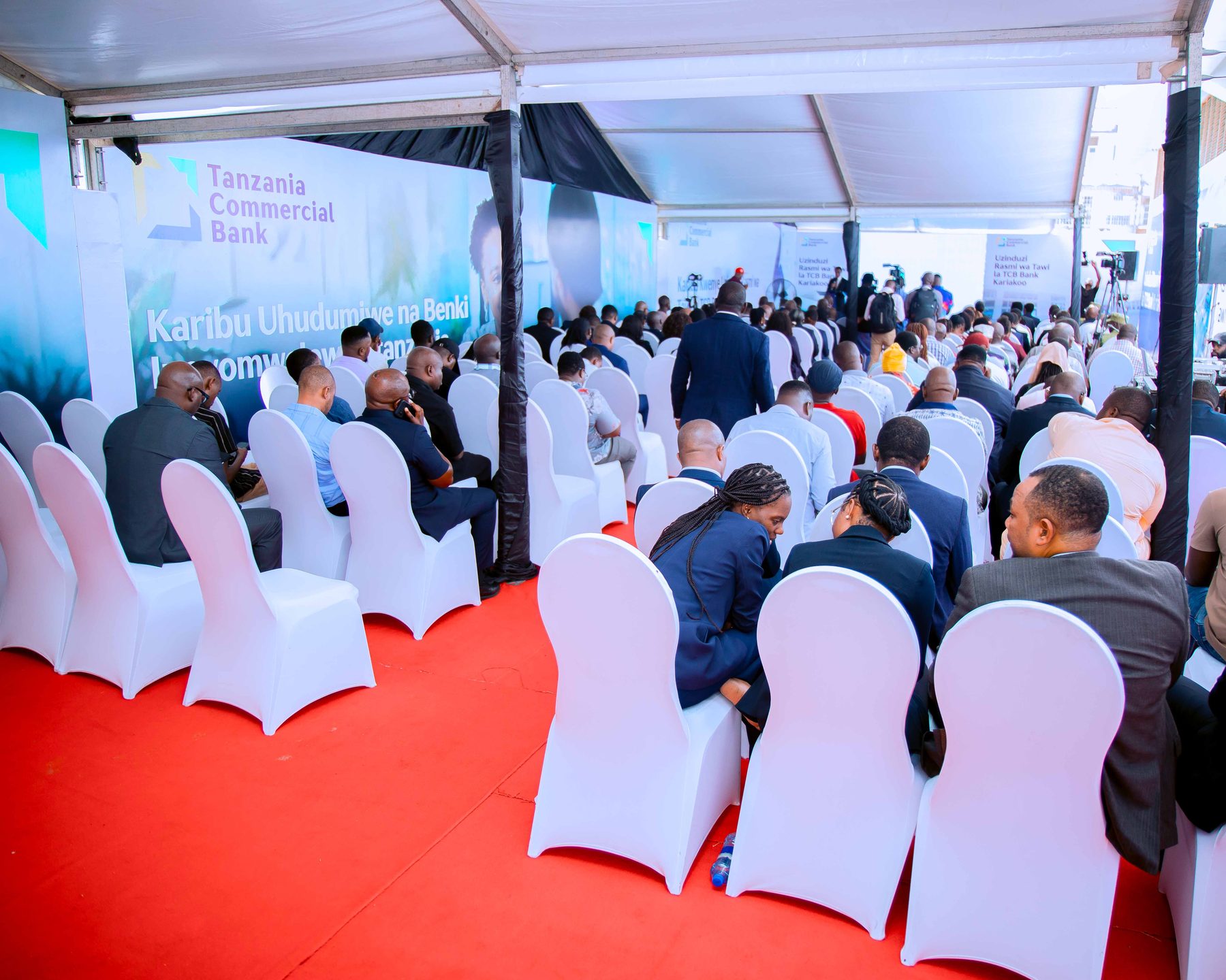 Guests seated under the launch tent at TCB's Kariakoo branch opening