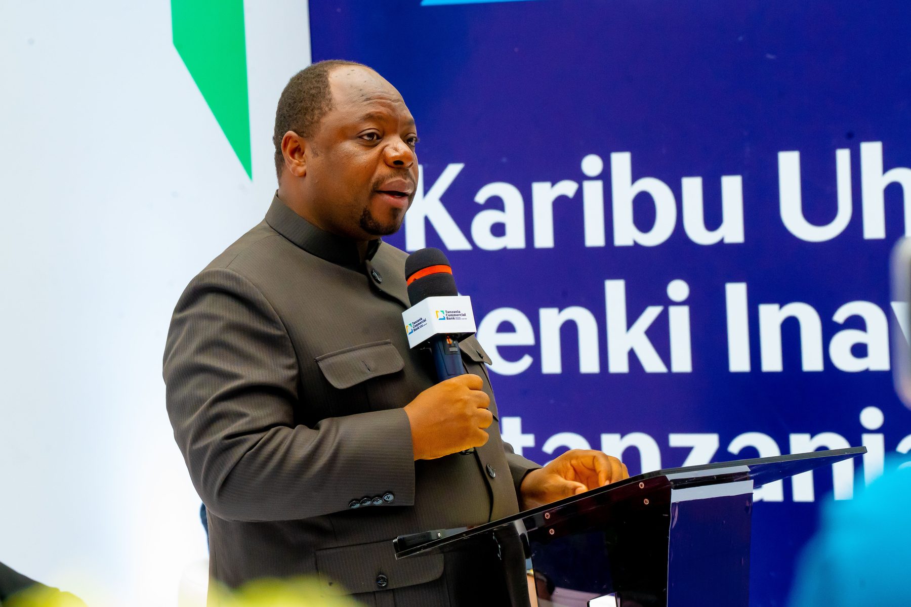 TCB executive addressing guests at the podium, Ubungo branch launch