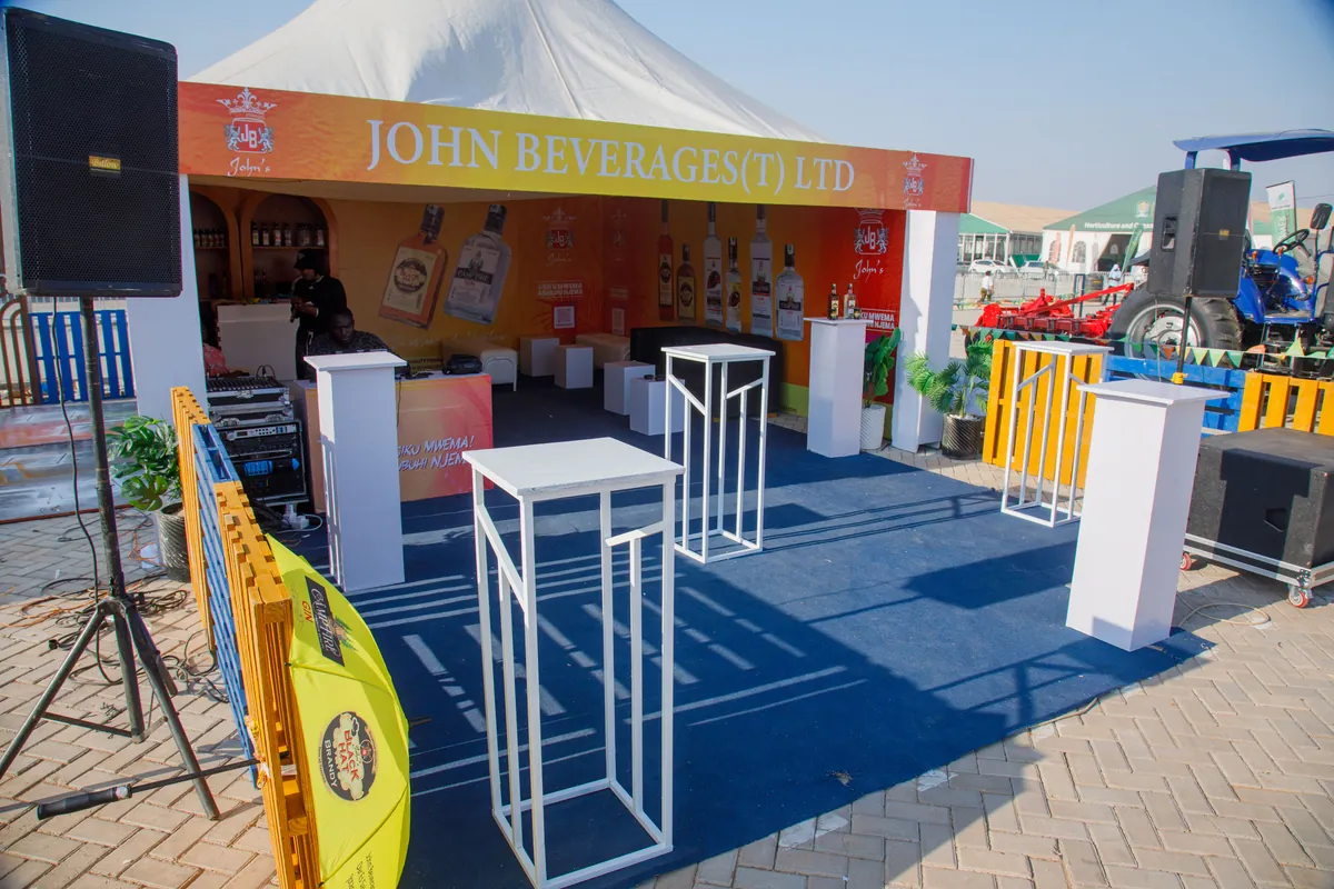 JBL exhibition booth entrance with branded signage and product display pedestals at Nane Nane Grounds